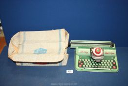 A 1950's Mettoy Supertype toy typewriter in green with original box (box a/f) 10" wide.