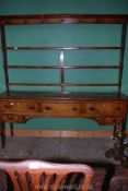 A medium Oak Welsh dresser, the base having three frieze drawers, two smaller drawers below,