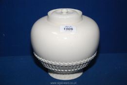 A Royal Worcester porcelain ivory glazed bulbous jar and inner cover with basket weave around base,
