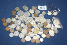 A quantity of foreign coins including 'Eire', Francs, Canada etc.