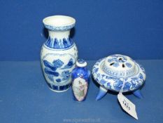 A Chinese porcelain table top model of an incense burner in blue convolvulus pattern,