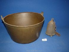 A heavy brass preserving pan 13" diameter x 6 1/2" tall and a heavy metal bell on chain.