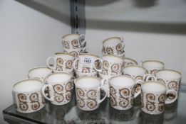 A part Wedgwood Susie Cooper design teaset with twelve cups, three saucers, six coffee cans,
