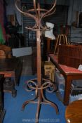 A bentwood Hat and coat Stand surmounted by a turned and lobed finial and with a maker's label "B.