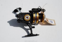 A vintage American made 'PENN 750SS' large spinning reel, with power drag and skirted spool.