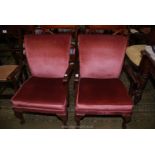 A pair of Parker Knoll style low open-armed Chairs for re-upholstery.