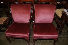 A pair of Parker Knoll style low open-armed Chairs for re-upholstery.