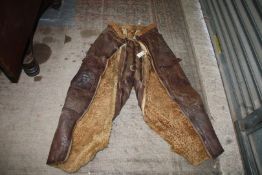 A pair of World War II RAF leather flying Trousers with sheepskin lining, (zip broken),