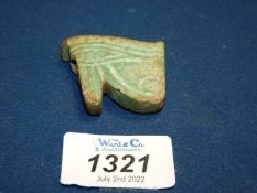 A large ancient Egyptian blue faience wajdet eye amulet, probably New Kingdom (chipped).