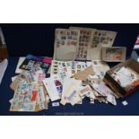 A small quantity of mixed stamps, loose stamp bags, tweezers, First Day Covers,