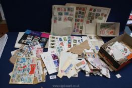 A small quantity of mixed stamps, loose stamp bags, tweezers, First Day Covers,