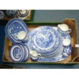 A quantity of blue and white china including Allertons' Willow pattern plates,