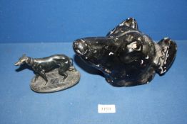 A model of a Greyhound and a black plaster Greyhound head. marked D. Bruccia, London.