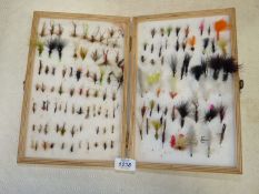 A large Shakespeare wooden double sided Fly Box and contents of a large quantity of Trout and