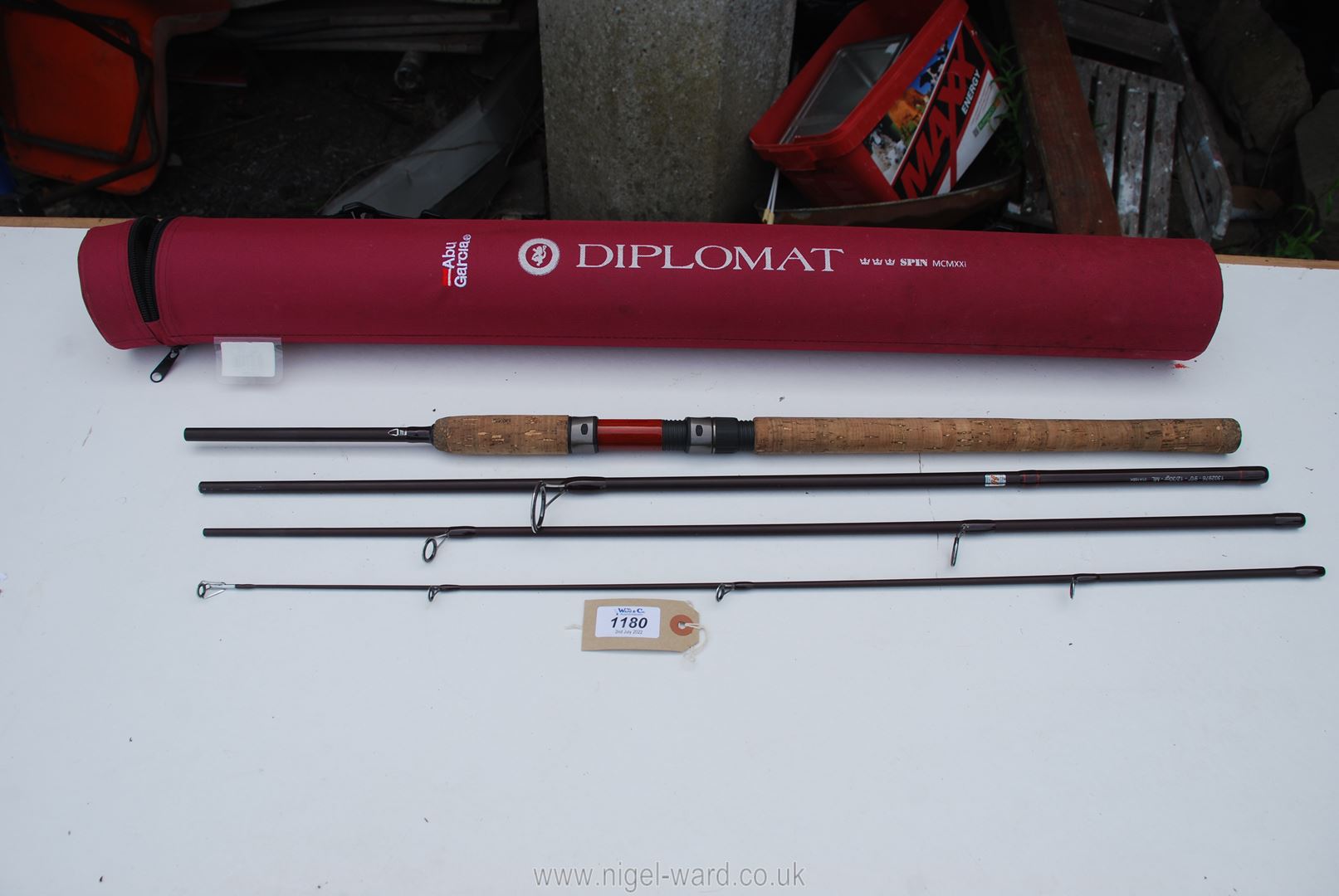 A very nice Abu Garcia four piece 9' 'Diplomat' spinning rod in dark burgundy finish in excellent