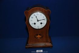 A wooden cased Mantle clock with Arabic numerals and presentation plaque for the marriage of Mr