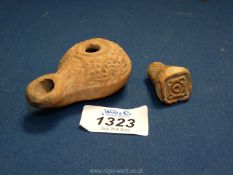 A fine Hellenistic terracotta oil lamp with well defined moulded decoration (2nd-1st c.