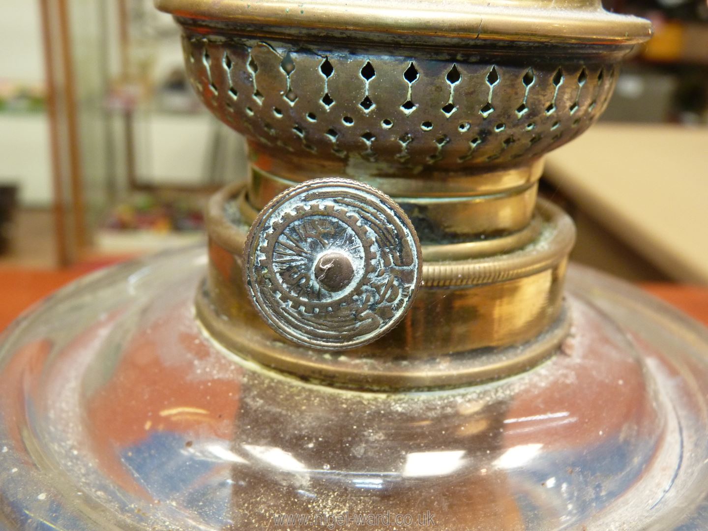 An Oil lamp on square brass bass, marbled effect stand, clear glass reservoir, no shade or chimney, - Image 6 of 12