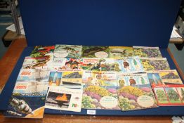 A quantity of Cigarette card albums including Prehistoric Animals, Space, Flowers, Olympics etc.