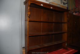 A dark Oak Bookshelves with upper turned details to the sides,