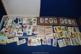 A quantity of cigarette cards including a small album of State Express 333 cigarettes, 'Speed, Land,