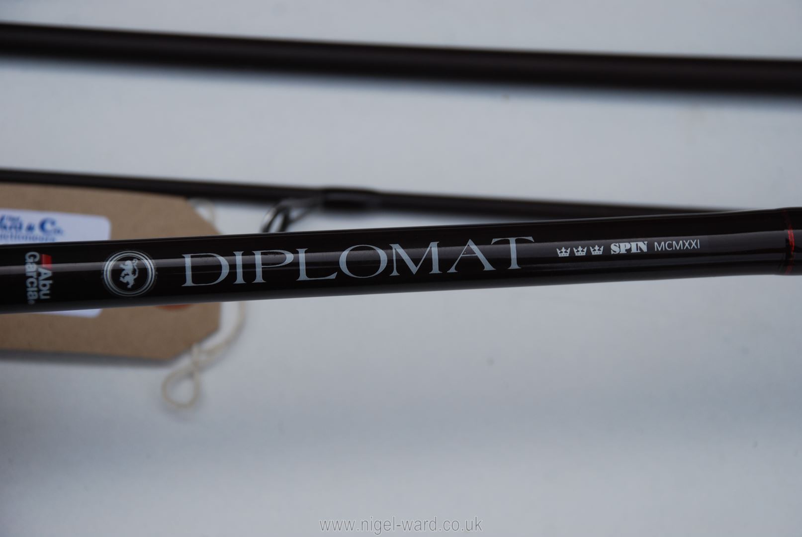 A very nice Abu Garcia four piece 9' 'Diplomat' spinning rod in dark burgundy finish in excellent - Image 2 of 2