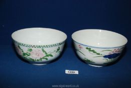 Two oriental bowls; one with painted pink flowers and green leaves, the other having green,