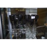 Ten glass silver lustre wine glasses.