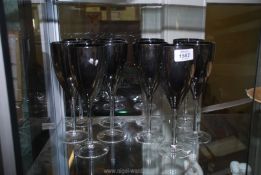Ten glass silver lustre wine glasses.
