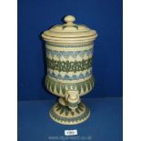 A Doulton Lambeth stoneware water filter/dispenser in urn shape with tap and lid having applied