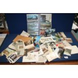 A small quantity of Postcards, greetings cards, black and white photographs,