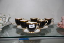 A set of six Royal Chelsea bone china cups & saucers in black with gilt rims.