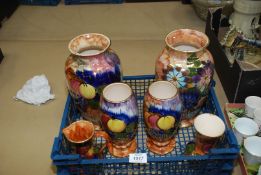 A quantity of hand painted Staffordshire Oldcourt matching vases decorated with fruit plus another