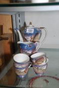 Japanese part teaset in blue and white to include four cups, six saucers, jug and teapot.