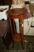 An Edwardian two tier circular satinwood plant Stand, inlaid in boxwood,