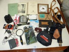 A quantity of angling items including a small leather Flymate, XL Kuny's braces, two multi tools,