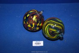 Two glass baubles with End of Day and swirl style design.