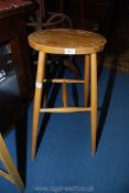 A Beech and other woods oval seated high Stool,