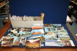 A large quantity of Postcards to include Glencoe, Canada, Wales, Paris, etc.