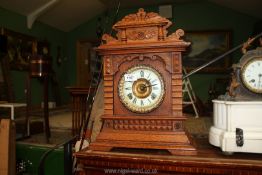 A wooden eight day mantle clock Syria made in Arizona by New York clock company, 18" tall.