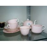 A Minton's part Tea for Two set in pink with gilt edging.
