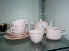 A Minton's part Tea for Two set in pink with gilt edging.