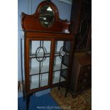 An attractive china Display Cabinet in Mahogany with lightwood stringing and cross-banding standing
