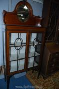 An attractive china Display Cabinet in Mahogany with lightwood stringing and cross-banding standing