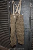 A World War II heated flying Trousers with coils sewn into the fabric and with braces, 24 volt No.