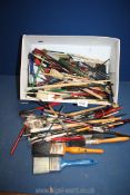 A good quantity of paint and artist brushes (some old.