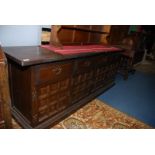 A contemporary darkwood Sideboard having three frieze drawers with brass shaped back plate drop