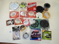 A good quantity of fly fishing beaching line and various weight nylon line, all in a box.