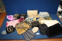 A quantity of purses and clutch bags including sequin, pink Radley bag, evening bags,