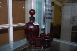 A ruby glass Venetian liqueur decanter and six glasses,